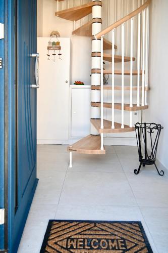 a rug on the floor in a hallway with a staircase at Mare Arcobaleno in Marzamemi