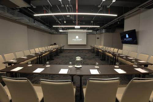 a conference room with a long table and chairs at Casa Andina Premium San Isidro in Lima
