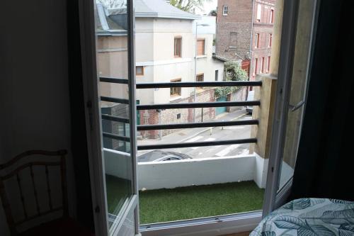 a view of a balcony from a bedroom window at Rouen Rive droite in Rouen