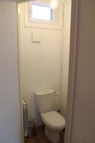 a small bathroom with a toilet and a window at Rouen Rive droite in Rouen