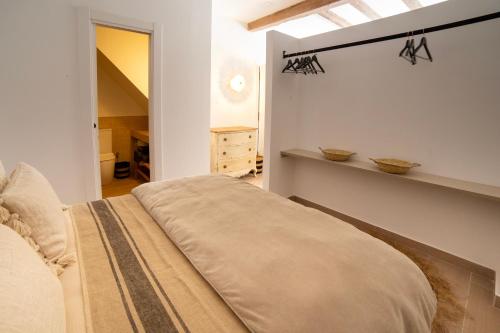 a bedroom with a bed in a room with a window at San Francisco de Borja 1 in Gandía