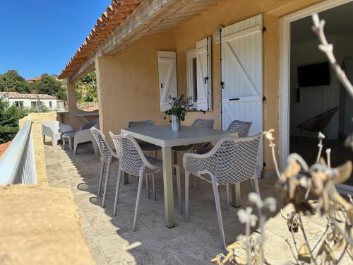 a table and chairs on the patio of a house at Dolce Vita in Propriano