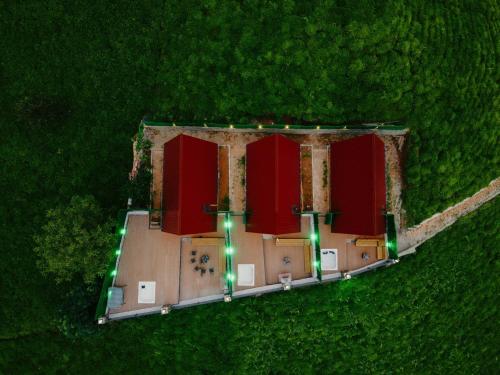 an overhead view of a building with green lights at YERUMONİ BUNGALOV in Çamlıhemşin