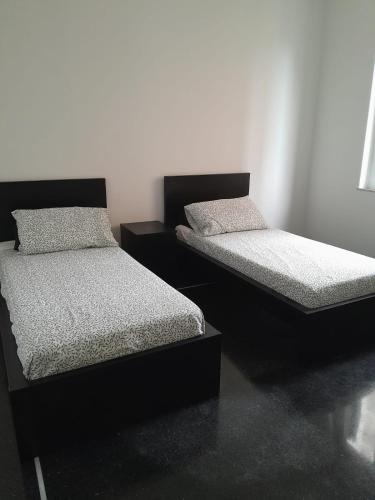 Postelja oz. postelje v sobi nastanitve Il Faro alloggi turistici
