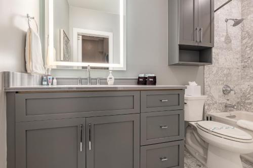 a bathroom with a sink and a toilet at The Livingston in New Orleans