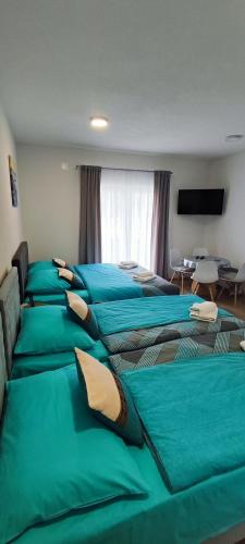 Apartmani Toki Balkanaにあるベッド