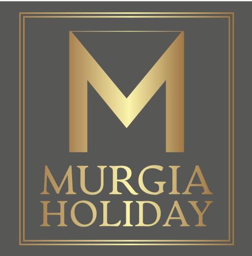 ein goldenes Schild mit dem Buchstaben n und der Text m Kaiserlicher Feiertag in der Unterkunft Murgia Holiday in Terlizzi