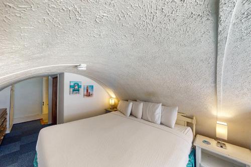 a bedroom with a bed and a white ceiling at Ambassador 311 in Panama City Beach