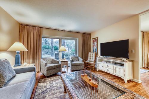 a living room with a couch and a tv at Heritage Villas 2307 in Hilton Head Island