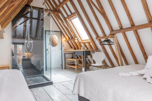 Postel nebo postele na pokoji v ubytování Texel lodge