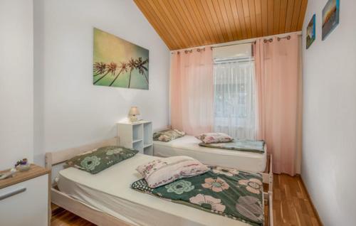 Postel nebo postele na pokoji v ubytování Villa Dora Crikvenica ##