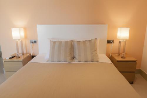 מיטה או מיטות בחדר ב-Hotel Novomar
