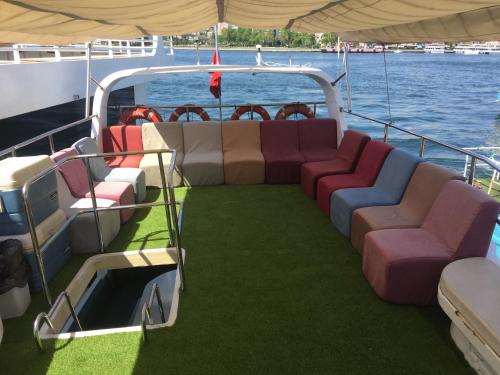 a boat with couches on the back of it at Kmtyachtstanbul in Istanbul