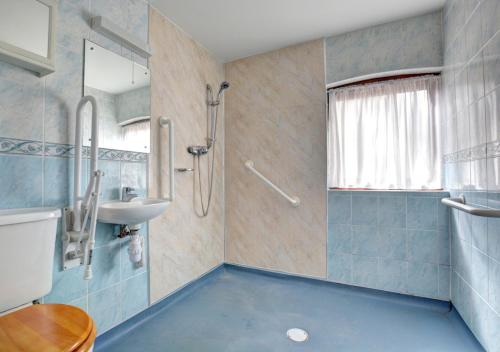 a bathroom with a sink and a shower at The Orchard in Lyng