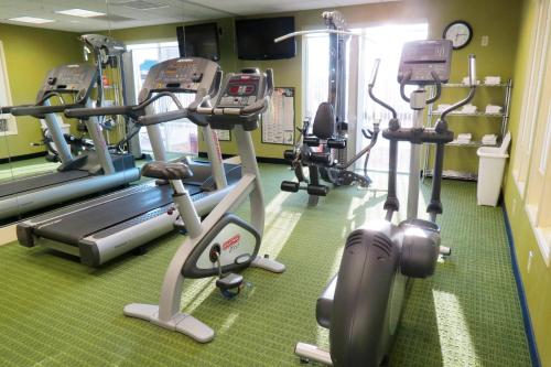a gym with several tread machines in a room at Fairfield Inn & Suites Mount Vernon Rend Lake in Mount Vernon