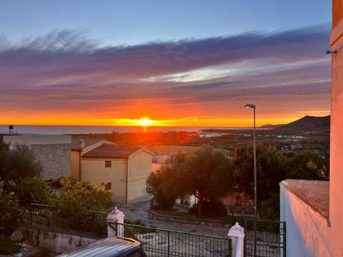 a sunset from the balcony of a house at Domus DELEDDA in Posada