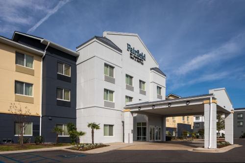 a white hotel with a sign on the front of it at Fairfield Inn & Suites by Marriott Mobile Daphne/Eastern Shore in Spanish Fort