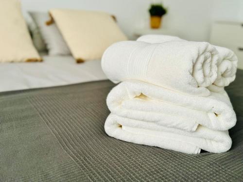 a stack of towels on the floor in a room at Chic & Stylish Madrid Hideout in Madrid