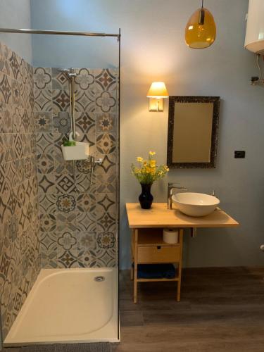 a bathroom with a sink and a shower at Da Cimonella bed & breakfast in Torre Ovo