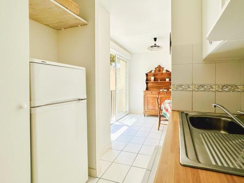 Kuchyň nebo kuchyňský kout v ubytování Appartement souplex en plein cœur des Sables dOlonne - 4 pers