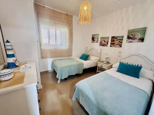 Ένα ή περισσότερα κρεβάτια σε δωμάτιο στο A823 - Cala Palmera - 2004 Finestrat s.l.