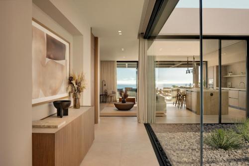 an open hallway with a living room and dining room at Royal Hideaway Corales Villas in Adeje