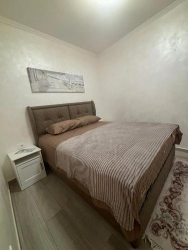 Кровать или кровати в номере Petar Apartment