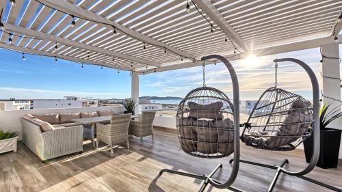 a pergola with swings on the roof of a house at Luxury Retreat Playa Laguna: 5-Bedroom Bliss in Puerto Peñasco