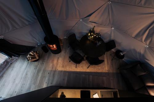 an overhead view of a room with a table and chairs at Golden Circle Domes - Lake View in Selfoss
