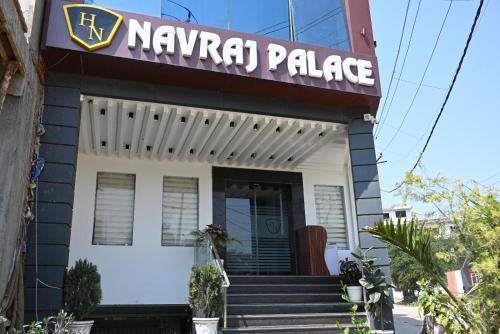 a napkin palace building with a sign on it at Hotel Navraj Palace in Gomti Nagar