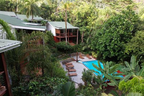 an aerial view of a house with a swimming pool at Cashew Nut Grove Chalets in Port Glaud
