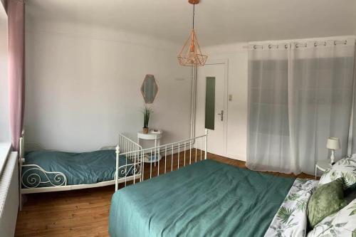 Cama o camas de una habitación en Gîte de la Costelle