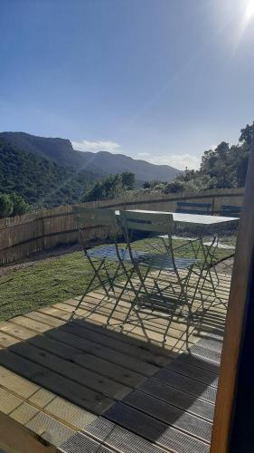 a table sitting on top of a patio with a view at holiday home su Niberalzu in Monti