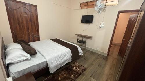 Katil atau katil-katil dalam bilik di Kerins Guest House