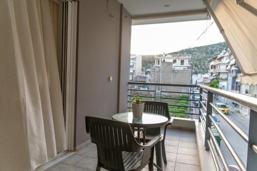 a balcony with a table and chairs and a view at 50 DANAIDES in Argos