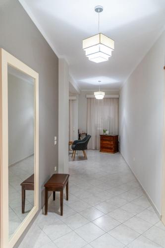 a hallway with a living room with a table and a chair at 50 DANAIDES in Argos