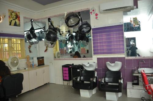 a bathroom with a sink and a mirror at SPA LAVENDER AND SUITES in Port Harcourt