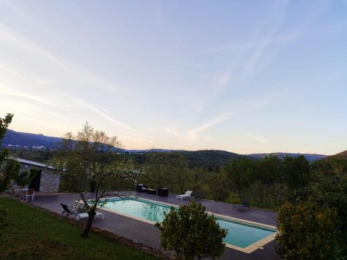 a swimming pool with a view of the mountains at Quinta dos Carvalhais - Serra da Estrela in Fornos de Algodres