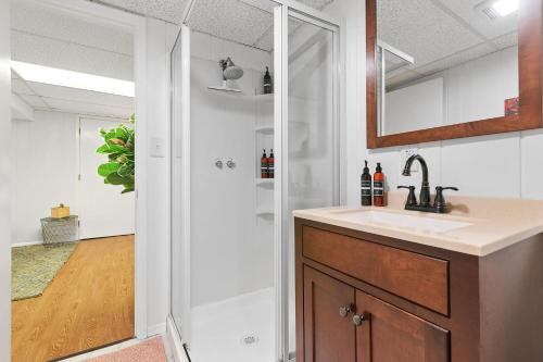 a bathroom with a sink and a shower at Highland Hideaway in Lilydale