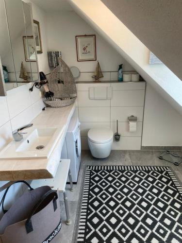 a bathroom with a sink and a toilet at Luckylake in Muhr amSee