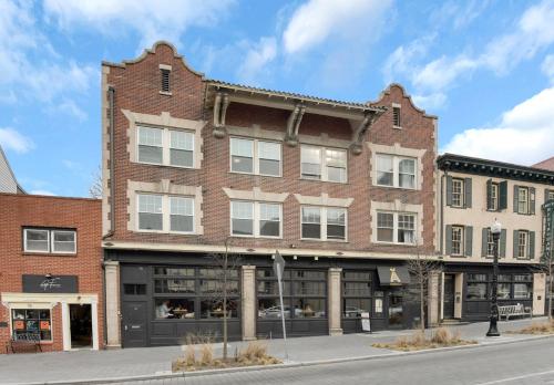a large brick building on a city street at Dreamy 2BR in Downtown Princeton in Princeton