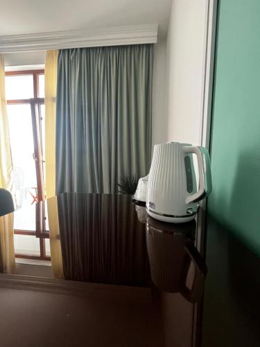 a machine on top of a toilet in a room at Riviera 990 - Resort & Restaurant in Eşelniţa
