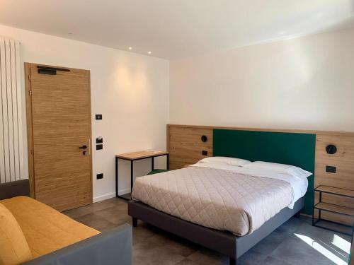 Hotel Locanda Alla Perlaにあるベッド