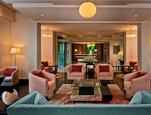 a living room with a couch and chairs and a table at Fortune Park, Ahmedabad - Member ITC Hotels' Group in Ahmedabad