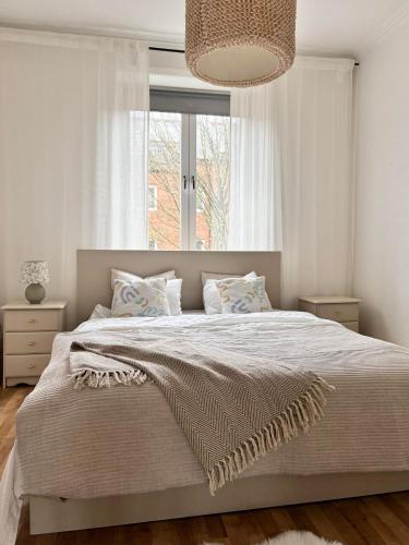 Una cama o camas en una habitación de City Central Apartment