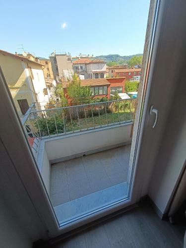 an open door to a balcony with a view at Le Coccole in La Spezia