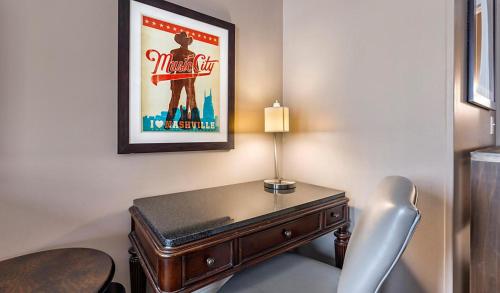 a desk in a room with a movie poster at Bluegreen Downtown Nashville in Nashville