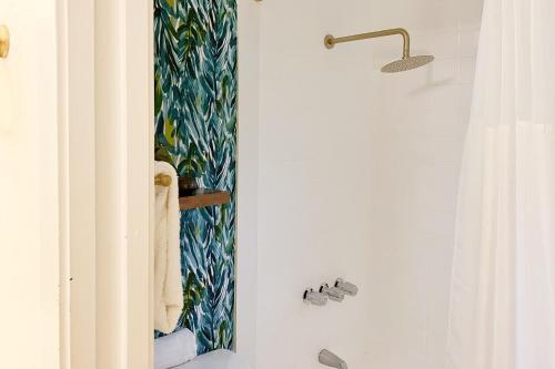 a bathroom with a shower curtain and a sink at Kona Bali Kai #161 in Kailua-Kona