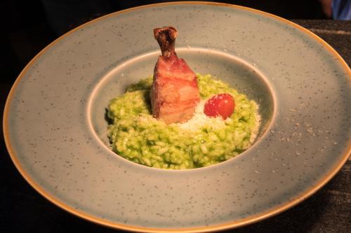 a bowl with a piece of meat on top of guacamole at Penzión ROYAL in Bytča