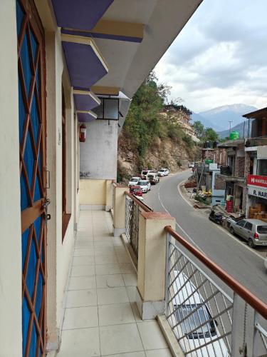 a balcony of a building with a view of a street at Abhishek guest house in Gupta Kāshi